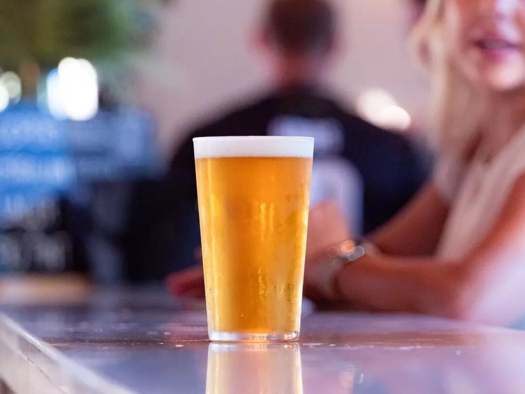 A cold beer being enjoyed at Broken Hill Hotel during the footy match.