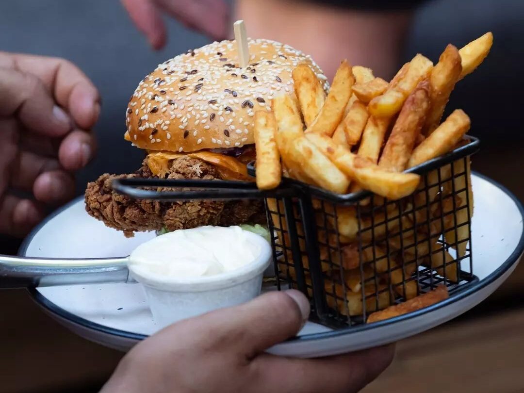 A juicy burger served at Broken Hill Hotel, a fan favourite for game day meals.