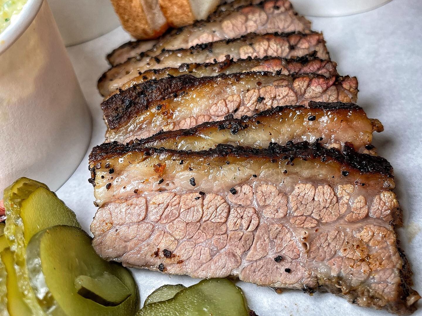 Tender brisket served at Frank's BBQ, a must-try for meat lovers after the game
