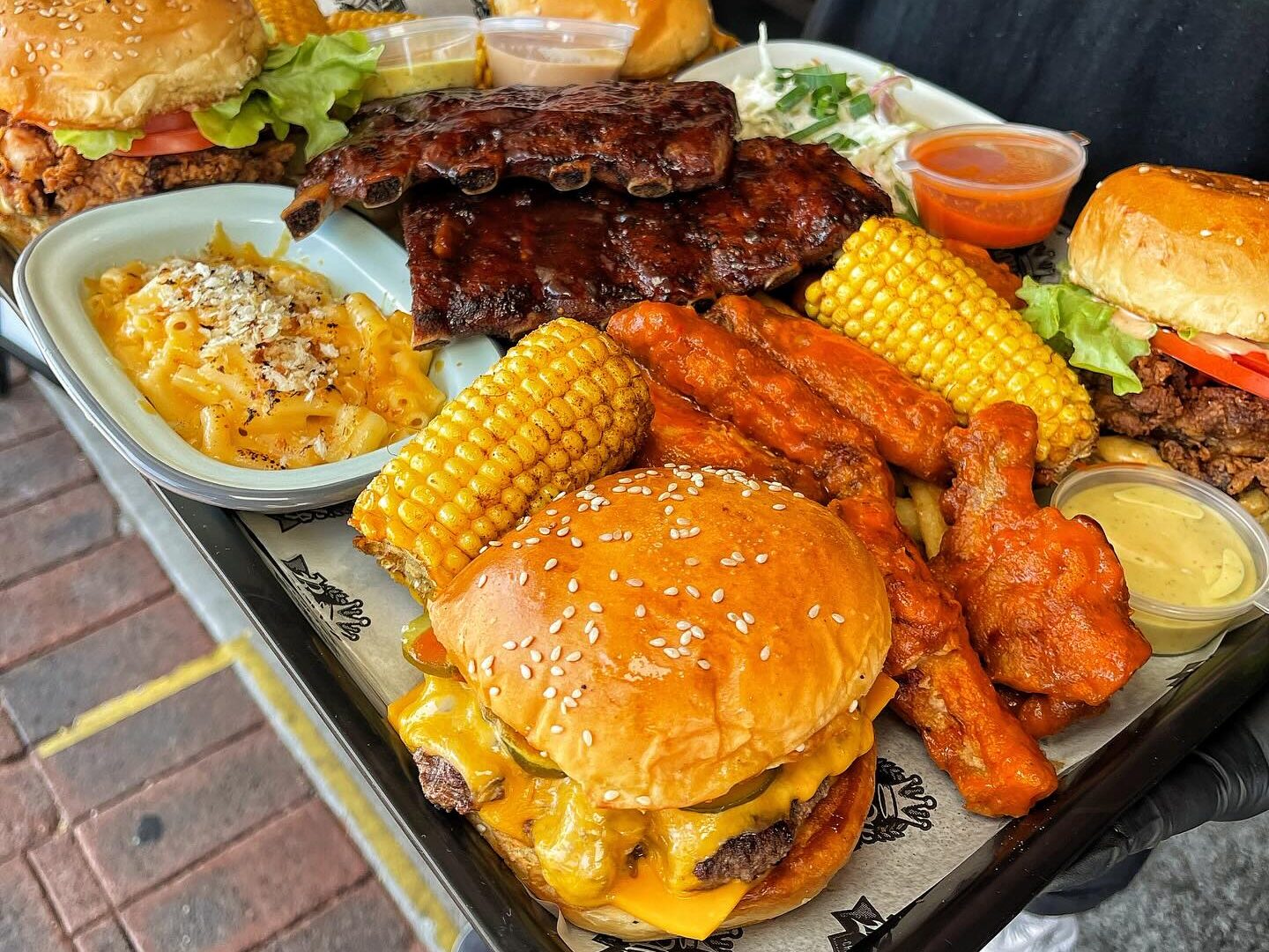 A meat and burger platter at RoyAl's, ideal for sharing after the footy
