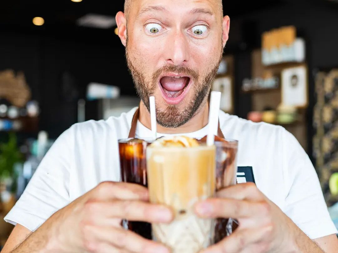 Barista preparing coffee at Social Manna cafe, a popular pre-footy spot in Victoria Park