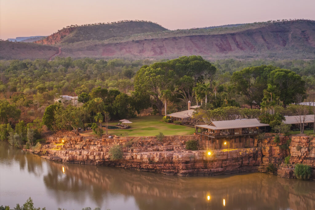 A luxurious lodge by the water in the Kimberley surrounded by greenery