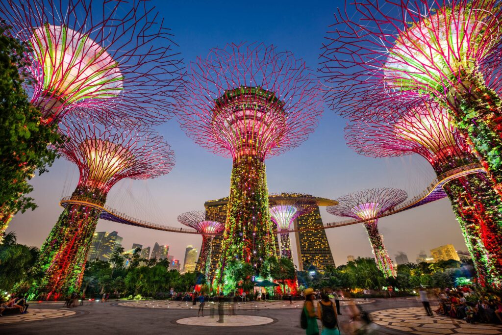 ‘Gardens by the Bay’ sculptures in Singapore glowing bright colours at sunset